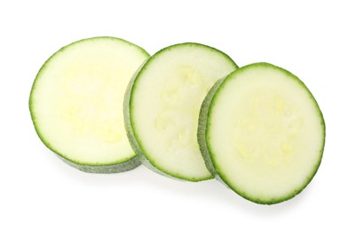 Photo of Pieces of fresh zucchini isolated on white, top view