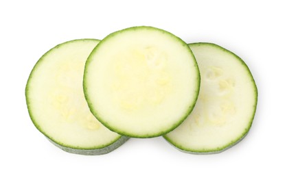 Photo of Pieces of fresh zucchini isolated on white, top view