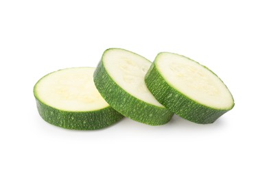 Photo of Pieces of fresh zucchini isolated on white