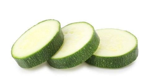 Photo of Pieces of fresh zucchini isolated on white