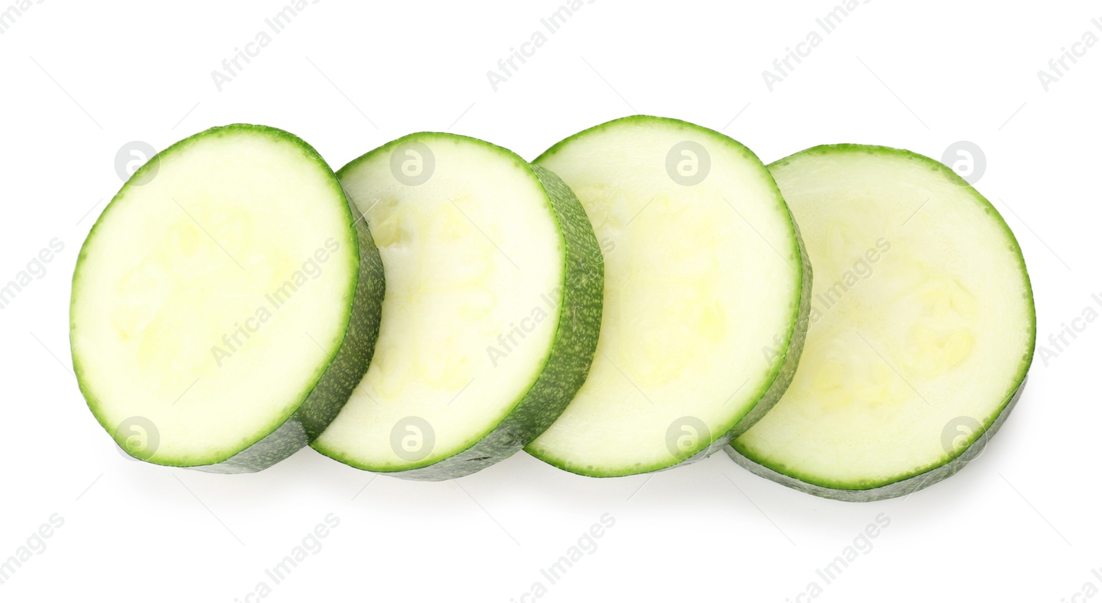 Pieces of fresh zucchini isolated on white, top view Photo of Pieces of fresh zucchini isolated on white, top view