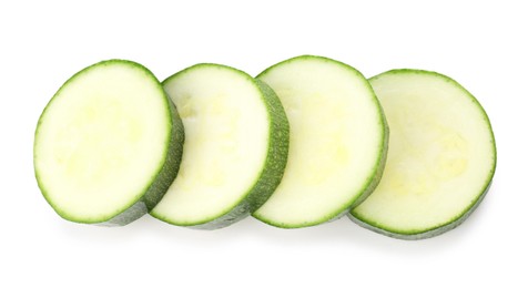 Photo of Pieces of fresh zucchini isolated on white, top view