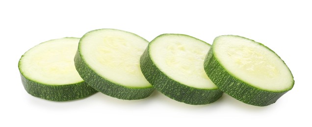 Photo of Pieces of fresh zucchini isolated on white