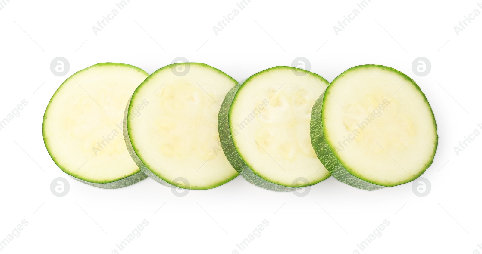 Pieces of fresh zucchini isolated on white, top view Photo of Pieces of fresh zucchini isolated on white, top view
