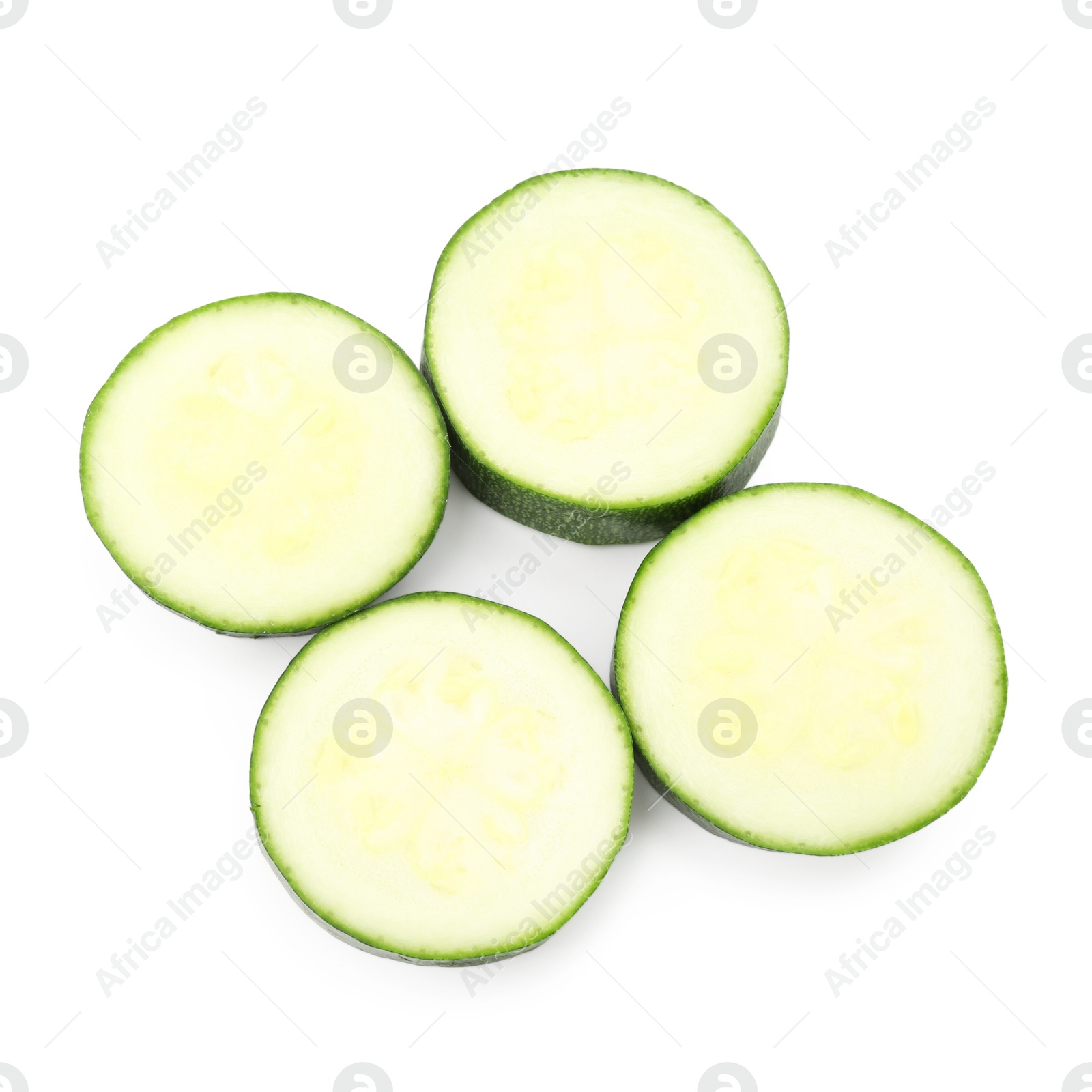 Pieces of fresh zucchini isolated on white, top view Photo of Pieces of fresh zucchini isolated on white, top view