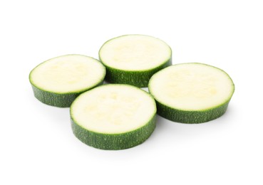 Photo of Pieces of fresh zucchini isolated on white