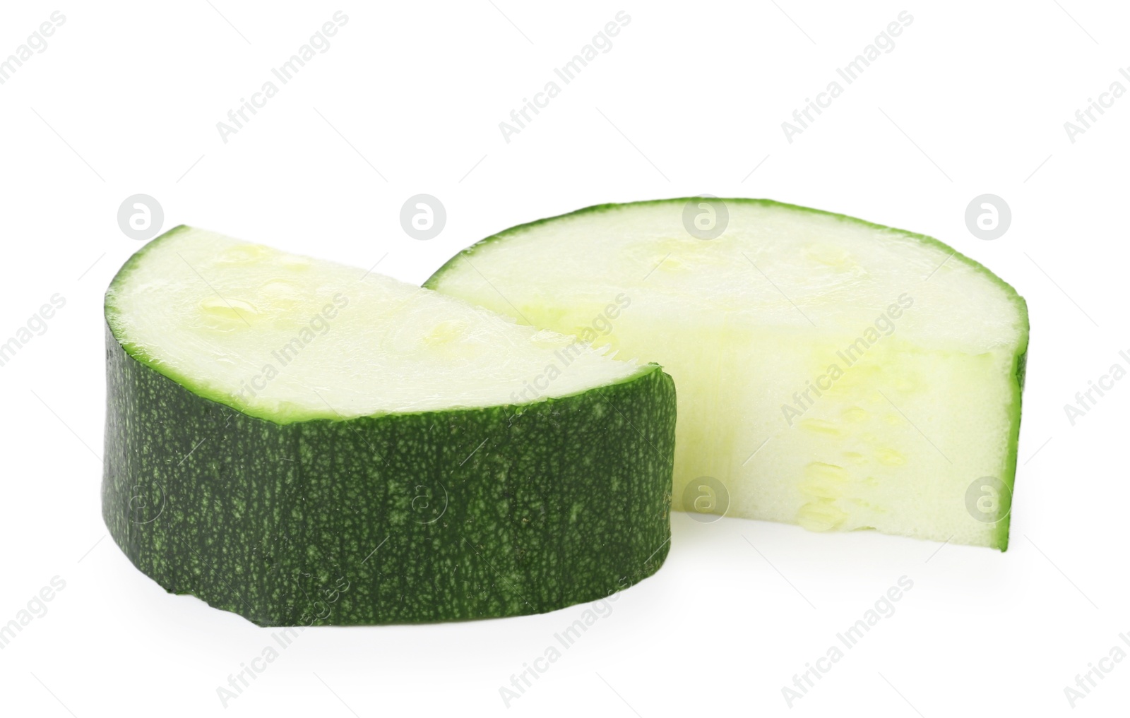 Pieces of fresh zucchini isolated on white Photo of Pieces of fresh zucchini isolated on white