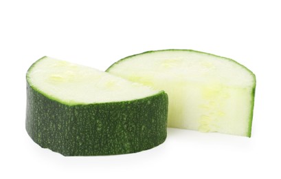 Photo of Pieces of fresh zucchini isolated on white