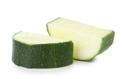 Photo of Pieces of fresh zucchini isolated on white