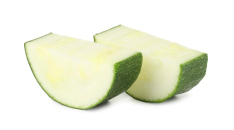 Photo of Pieces of fresh zucchini isolated on white