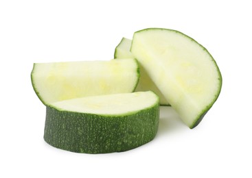 Photo of Pieces of fresh zucchini isolated on white