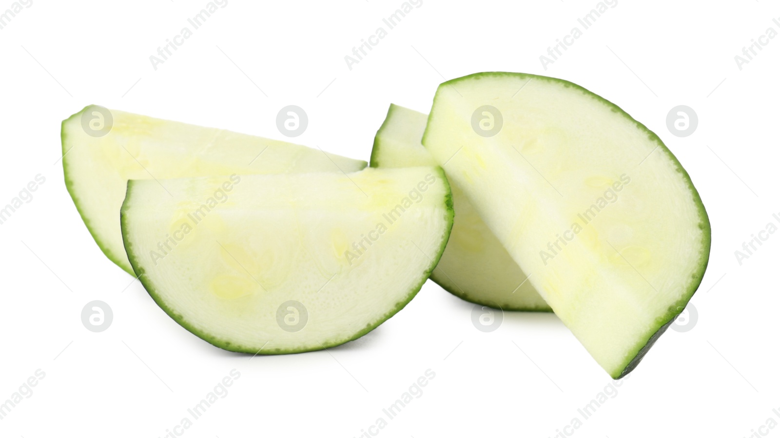 Pieces of fresh zucchini isolated on white Photo of Pieces of fresh zucchini isolated on white