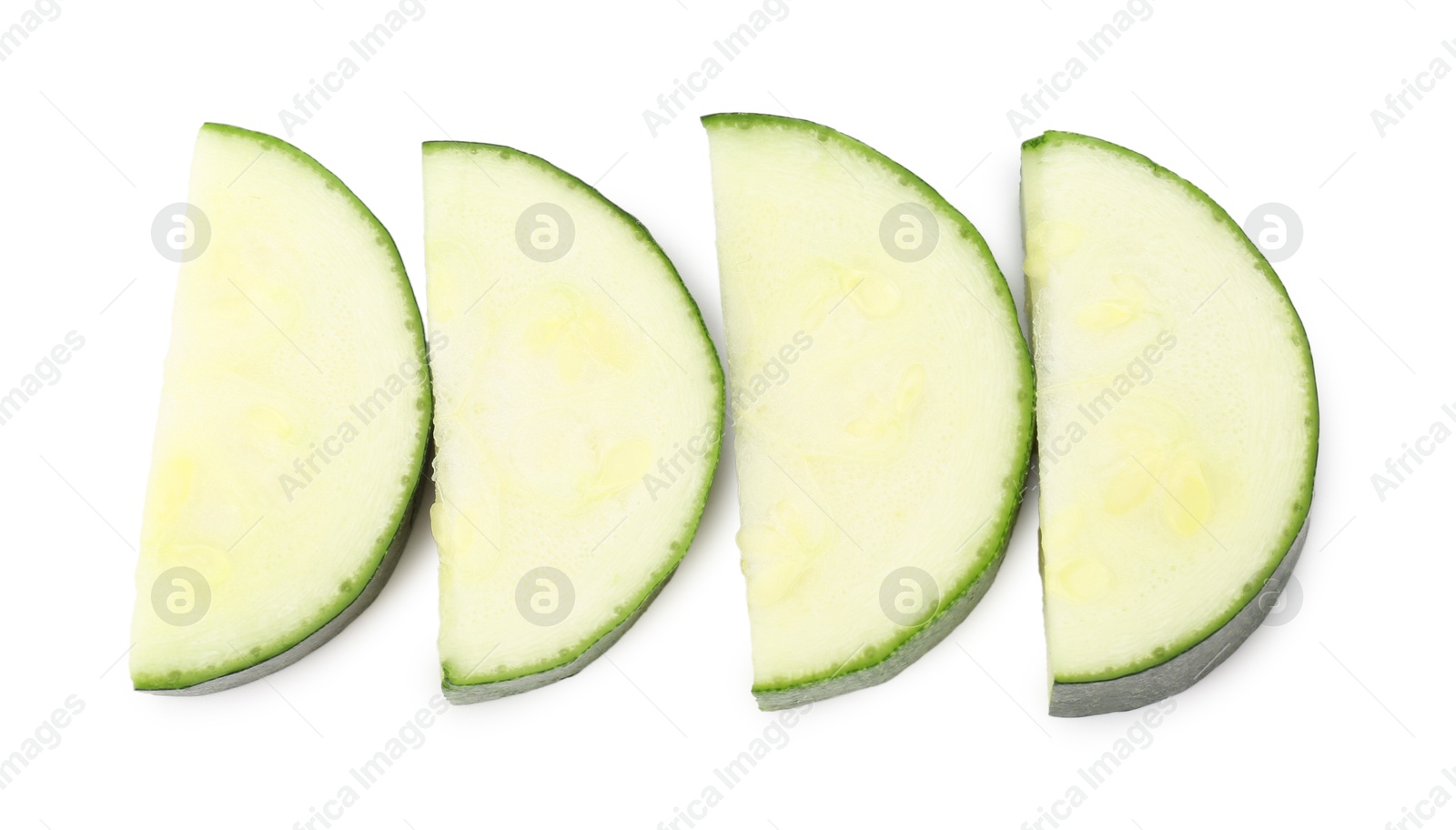 Pieces of fresh zucchini isolated on white, top view Photo of Pieces of fresh zucchini isolated on white, top view