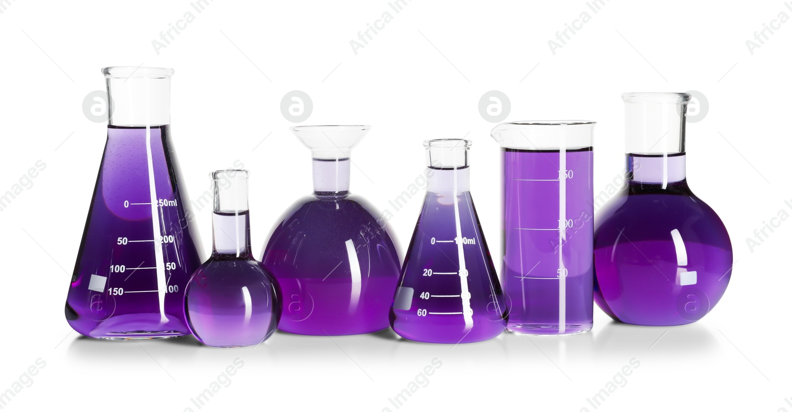 Photo of Laboratory glassware with violet liquid isolated on white