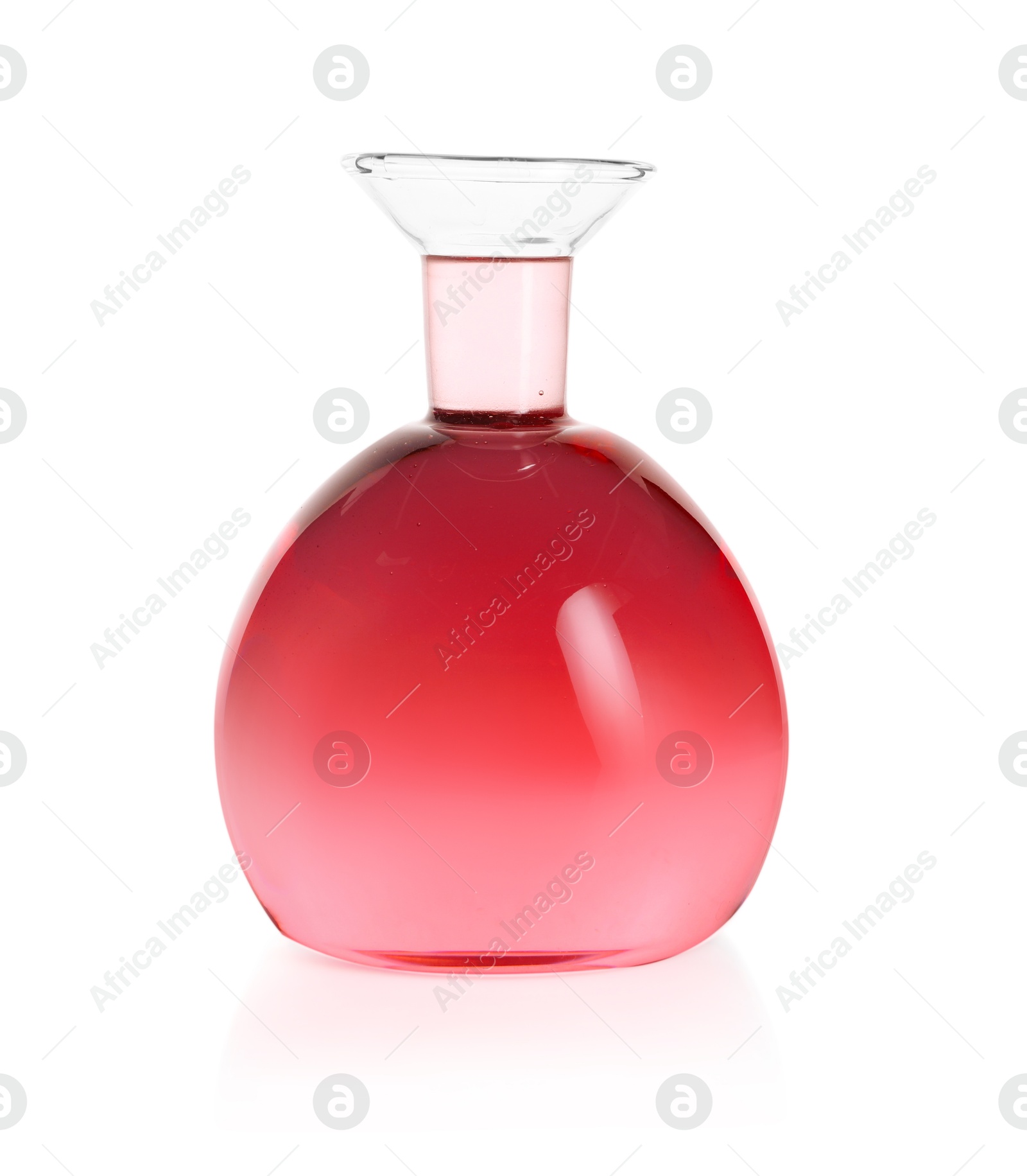Photo of Round flask with pink liquid isolated on white