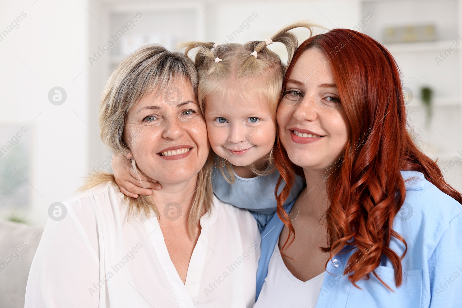 Grandmother, her daughter and granddaughter at home Photo of Grandmother, her daughter and granddaughter at home