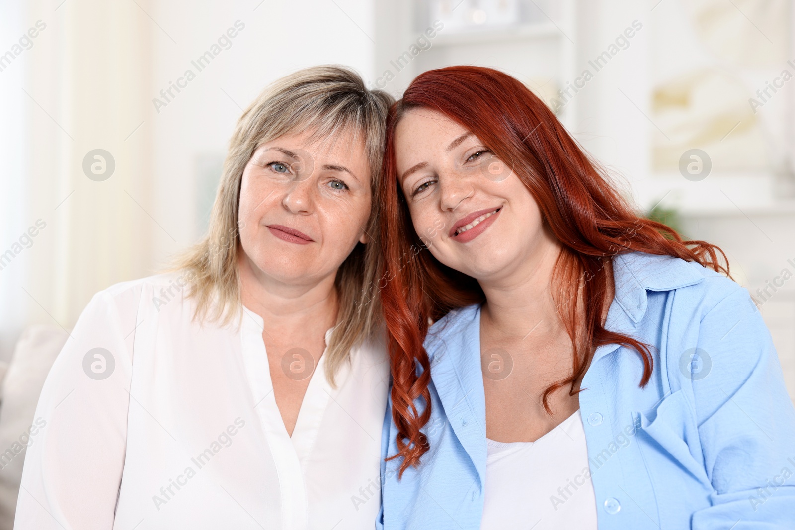 Portrait of mother and her daughter at home Photo of Portrait of mother and her daughter at home