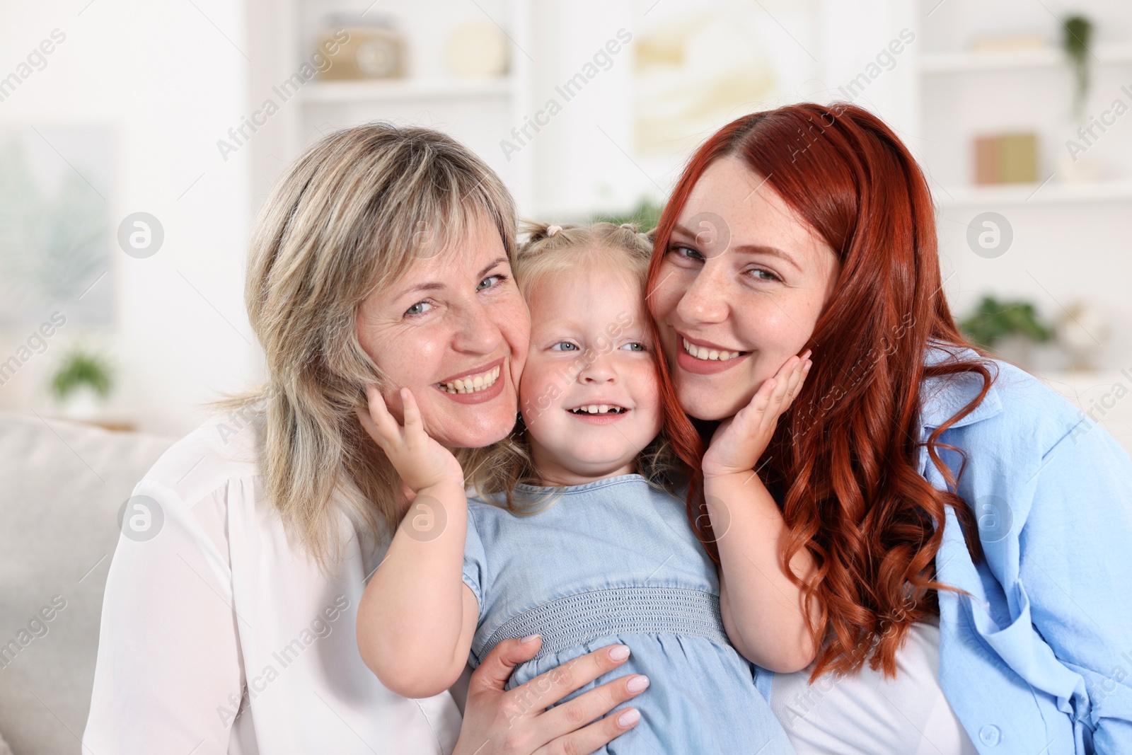 Grandmother, her daughter and granddaughter at home Photo of Grandmother, her daughter and granddaughter at home