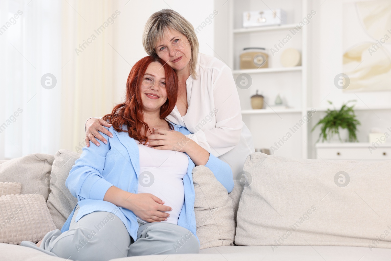 Pregnant woman and her mother at home Photo of Pregnant woman and her mother at home
