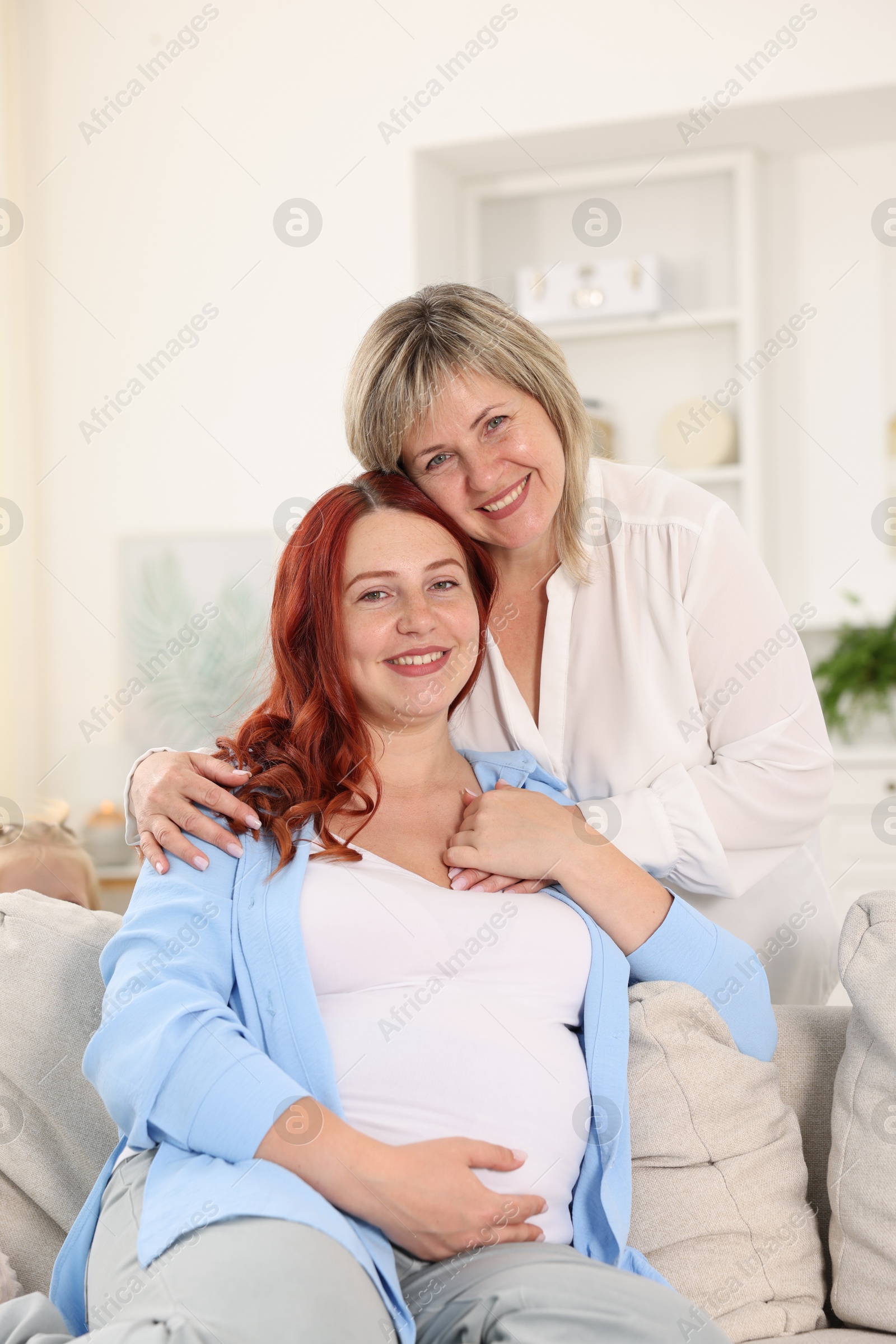 Pregnant woman and her mother at home Photo of Pregnant woman and her mother at home