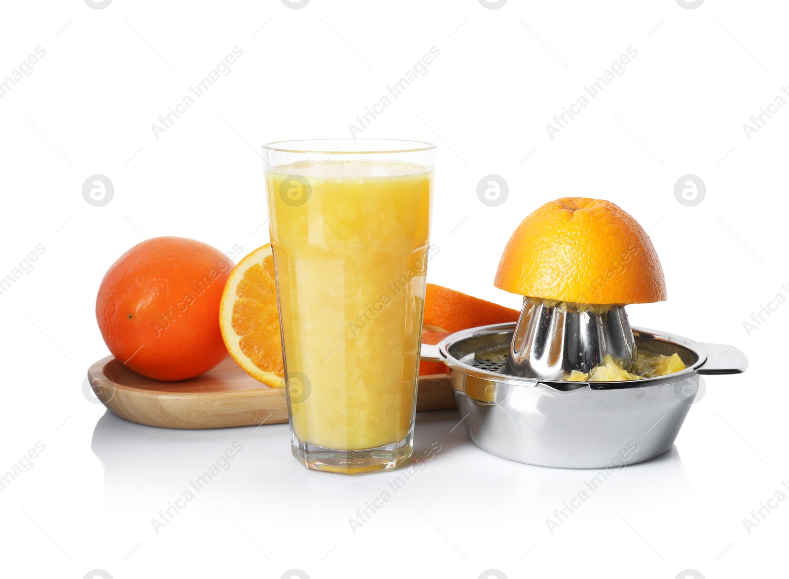Freshly squeezed orange juice, fruits and juicer isolated on white Photo of Freshly squeezed orange juice, fruits and juicer isolated on white