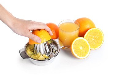 Photo of Making juice. Woman with orange using juicer on white background, closeup