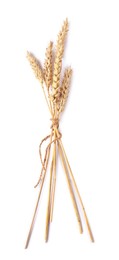 Photo of Bunch of dried wheat ears isolated on white, top view