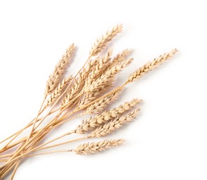 Photo of Many dried wheat ears isolated on white, top view