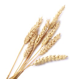 Photo of Many dried wheat ears isolated on white, top view
