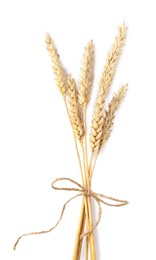 Photo of Bunch of dried wheat ears isolated on white, top view