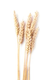 Photo of Many dried wheat ears isolated on white, top view
