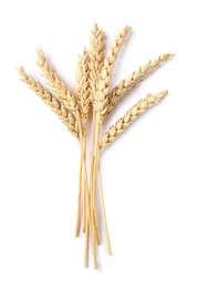 Photo of Many dried wheat ears isolated on white, top view