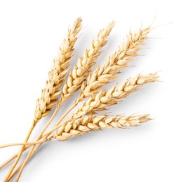Photo of Many dried wheat ears isolated on white, top view