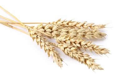 Photo of Many dried wheat ears isolated on white