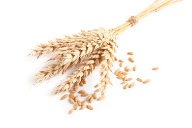 Photo of Bunch of wheat ears and seeds isolated on white