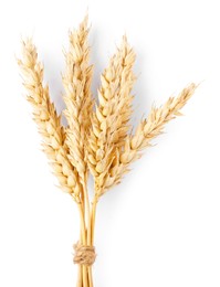 Photo of Bunch of dried wheat ears isolated on white, top view