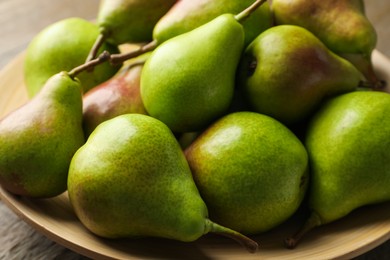 Photo of Many fresh ripe pears on table, closeup