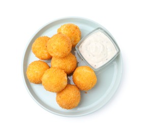 Photo of Delicious fried croquette balls and sauce isolated on white, top view