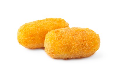 Photo of Two delicious fried croquettes isolated on white