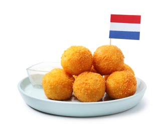 Photo of Delicious fried croquette balls and flag of Netherlands isolated on white