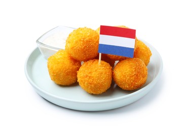 Photo of Delicious fried croquette balls and flag of Netherlands isolated on white