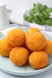 Photo of Delicious fried croquette balls on table, closeup