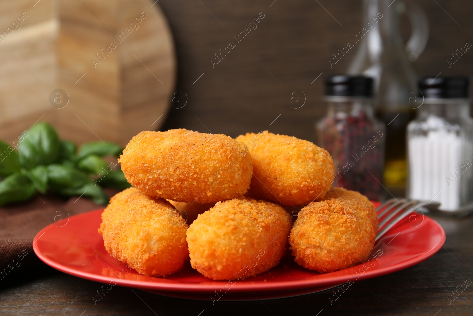 Many delicious fried croquettes on table, closeup Photo of Many delicious fried croquettes on table, closeup