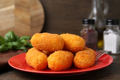 Photo of Many delicious fried croquettes on table, closeup