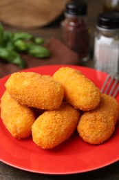 Photo of Many delicious fried croquettes on table, closeup