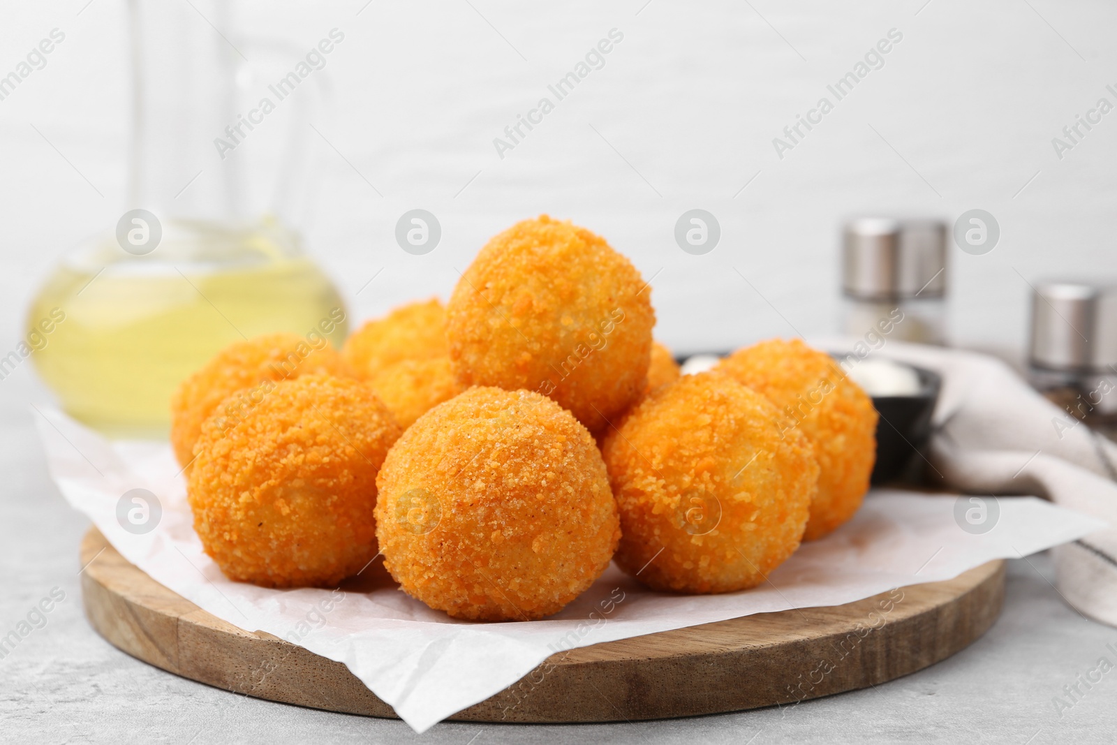 Delicious fried croquette balls on gray table, closeup Photo of Delicious fried croquette balls on gray table, closeup