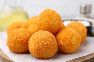 Photo of Delicious fried croquette balls on table, closeup