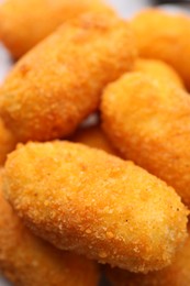 Photo of Many delicious fried croquettes as background, closeup