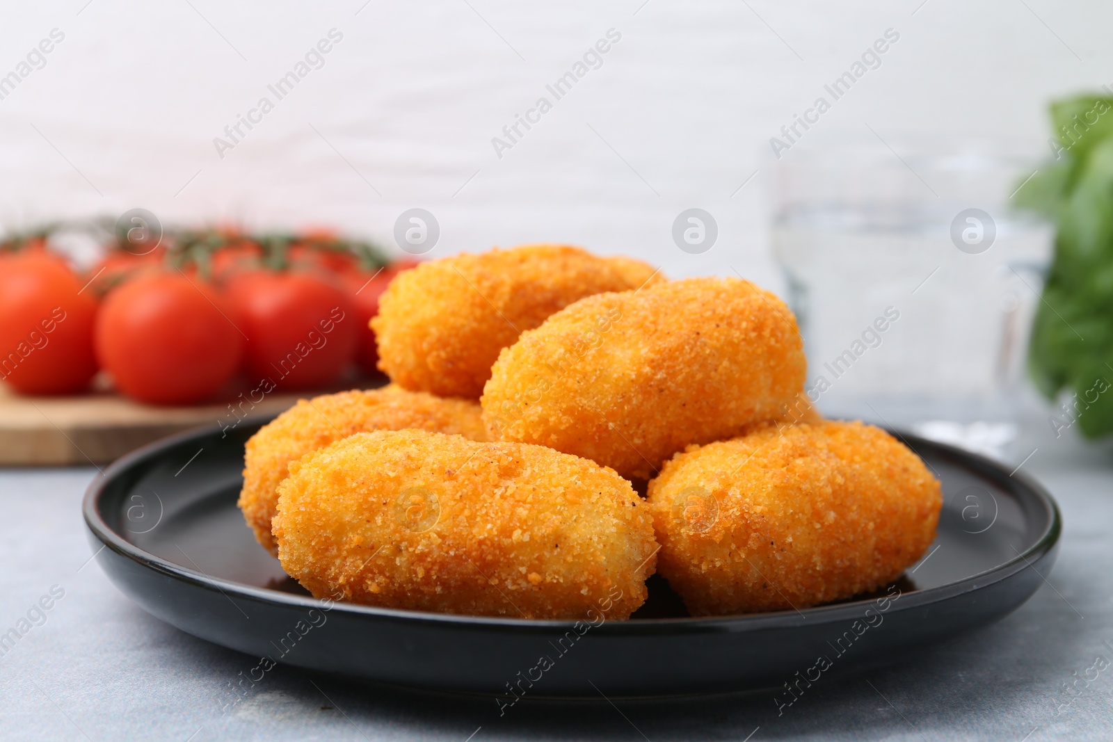 Delicious fried croquettes on gray table, closeup Photo of Delicious fried croquettes on gray table, closeup
