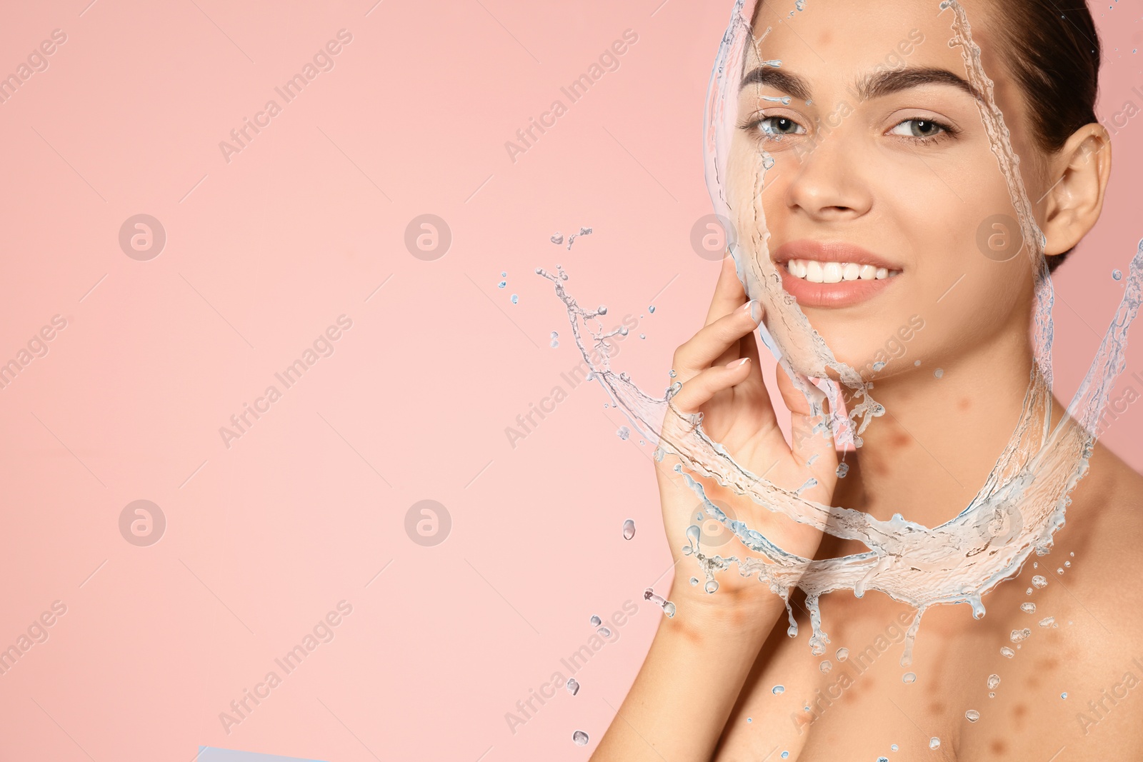 Woman with smooth skin and water splashes on pink background. Space for text Image of Woman with smooth skin and water splashes on pink background. Space for text